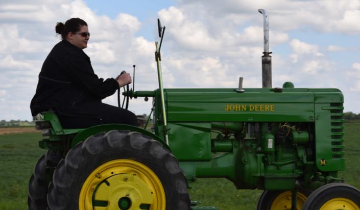 Driving a John Deere tractor is just part of the fun